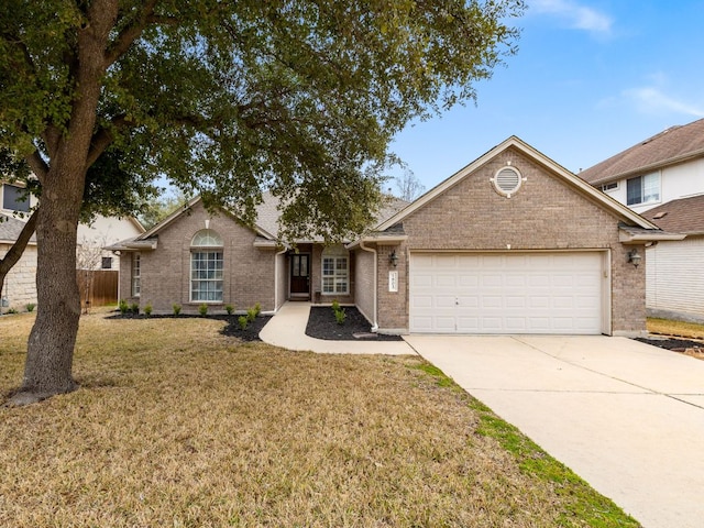 ranch-style home featuring a garage, concrete driveway, fence, a front lawn, and brick siding