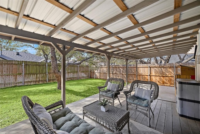 deck with a fenced backyard, a yard, and an outdoor living space