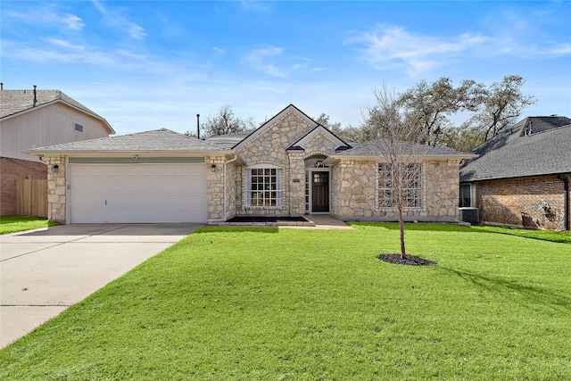 french provincial home featuring central AC, fence, a garage, driveway, and a front lawn