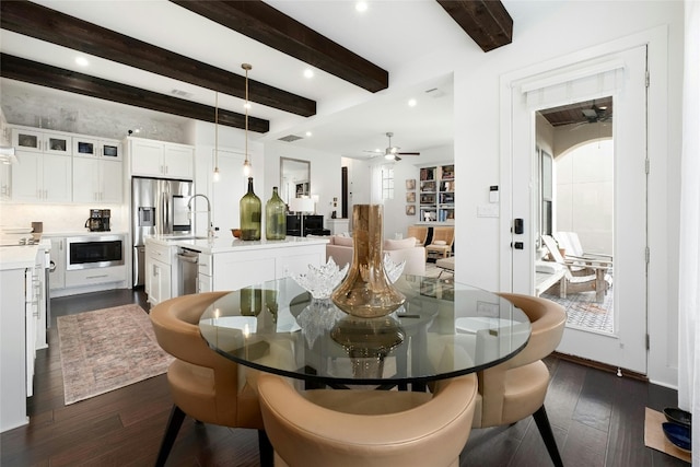 dining room with dark wood-style floors, recessed lighting, beamed ceiling, and a ceiling fan