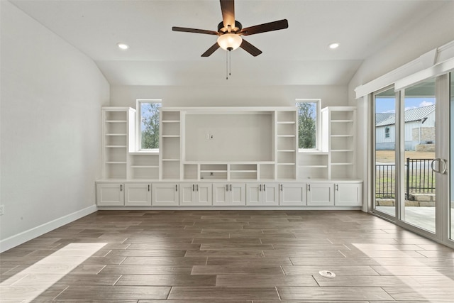 unfurnished living room featuring recessed lighting, ceiling fan, dark wood finished floors, and lofted ceiling