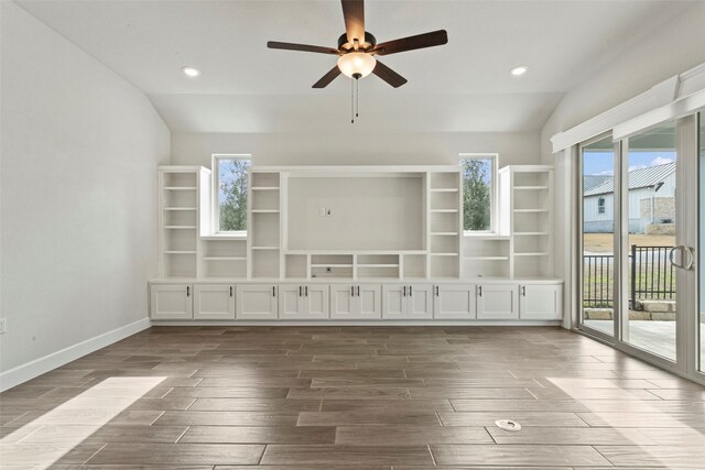 211 Singing Sumac Way, San Marcos, TX 78666 - unfurnished living room featuring dark wood-style flooring, lofted ceiling, a ceiling fan, and recessed lighting