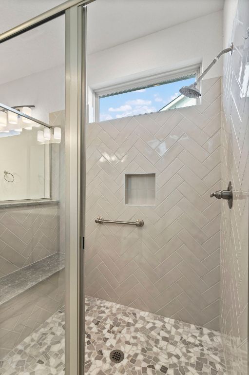 bathroom with a shower stall