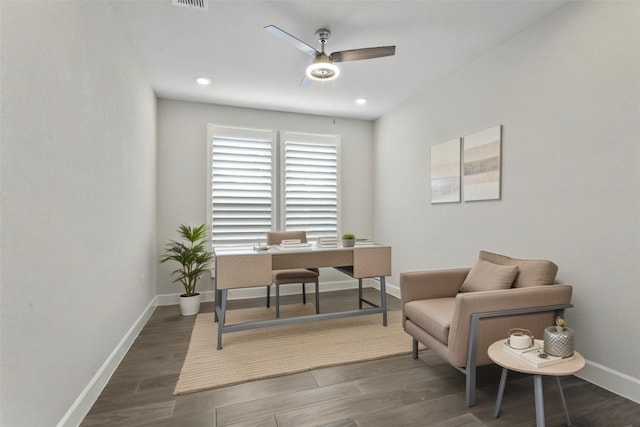 office with baseboards, a ceiling fan, wood finished floors, and visible vents