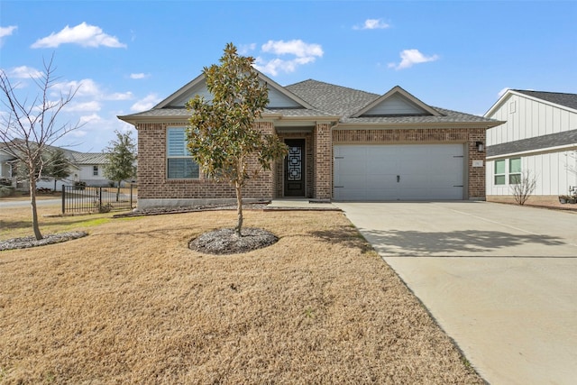 single story home with brick siding, a garage, driveway, and roof with shingles