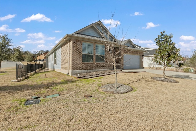 ranch-style house featuring brick siding, concrete driveway, an attached garage, fence, and a front lawn