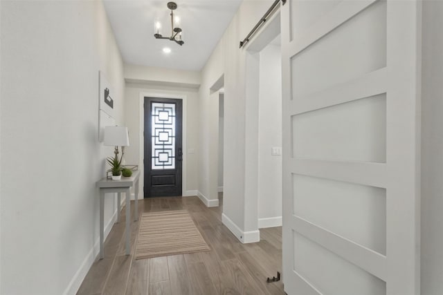 211 Singing Sumac Way, San Marcos, TX 78666 - doorway to outside featuring light wood-type flooring and recessed lighting