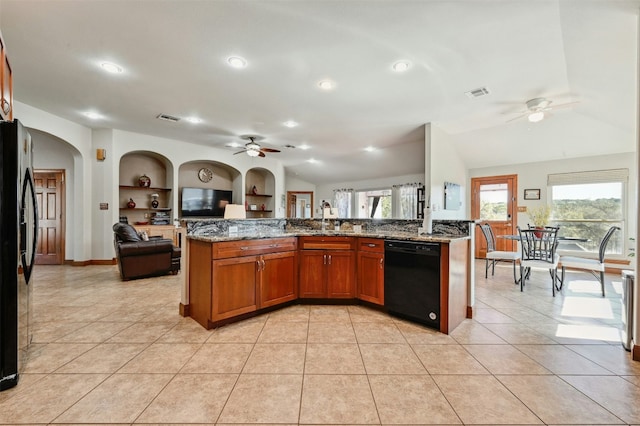 kitchen featuring visible vents, open floor plan, black appliances, built in shelves, and light tile patterned flooring