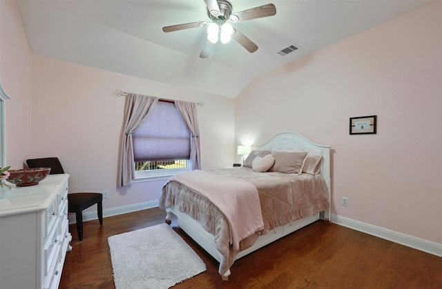 bedroom featuring lofted ceiling, visible vents, dark wood-type flooring, a ceiling fan, and baseboards