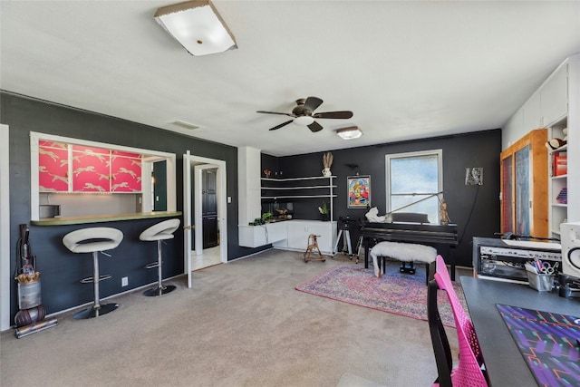 game room featuring carpet floors, visible vents, a dry bar, and a ceiling fan