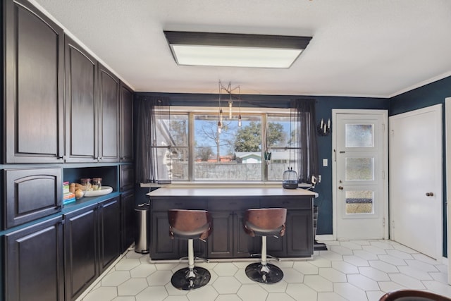 kitchen featuring ornamental molding and light countertops