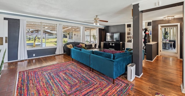215 S Mulberry St, Luling, TX 78648 - living room with ceiling fan and wood finished floors