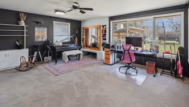 215 S Mulberry St, Luling, TX 78648 - carpeted home office with ceiling fan and healthy amount of natural light