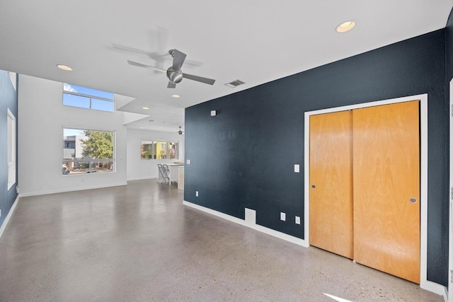 unfurnished living room featuring baseboards, recessed lighting, visible vents, and a ceiling fan