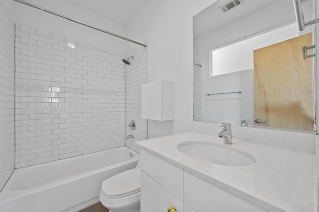 full bath with  shower combination, visible vents, vanity, and toilet