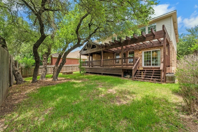 rear view of property featuring a deck, a yard, a fenced backyard, and a pergola