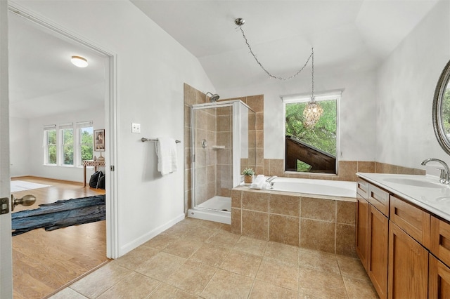 full bath with lofted ceiling, a shower stall, a bath, and tile patterned floors