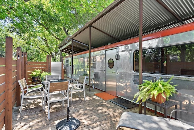 sunroom / solarium with outdoor dining area