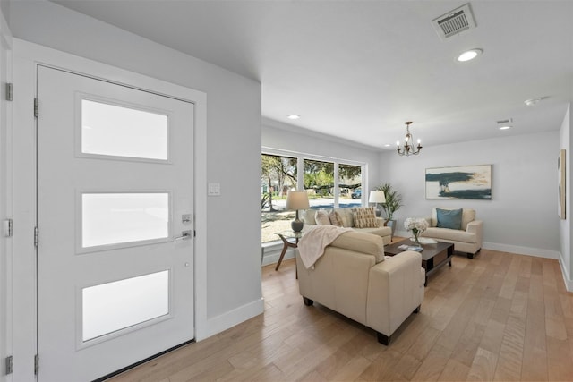 foyer entrance featuring a chandelier, recessed lighting, visible vents, baseboards, and light wood-type flooring