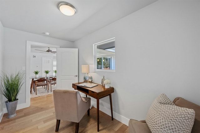 office space featuring light wood-style floors and baseboards