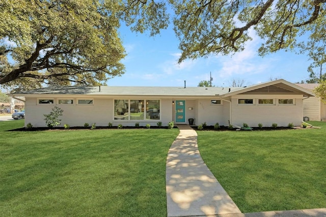 ranch-style house with a front lawn