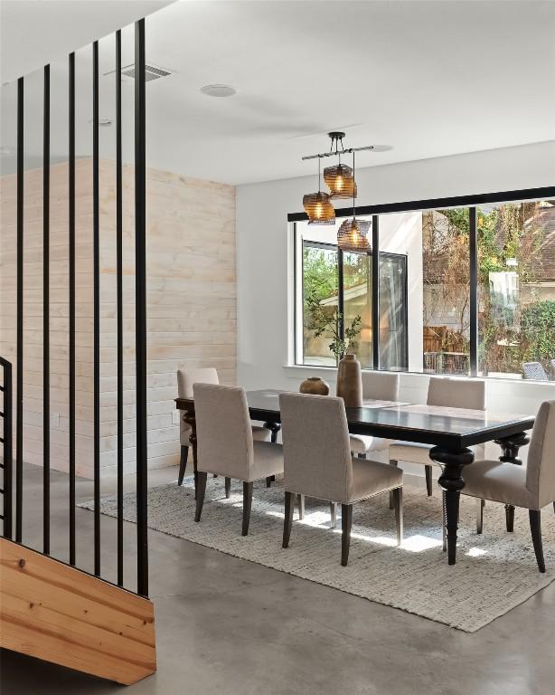 dining area featuring finished concrete flooring