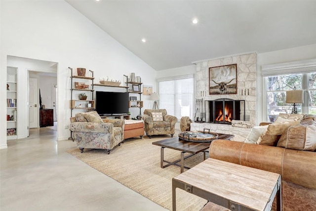 living area with concrete flooring, high vaulted ceiling, recessed lighting, a large fireplace, and built in features