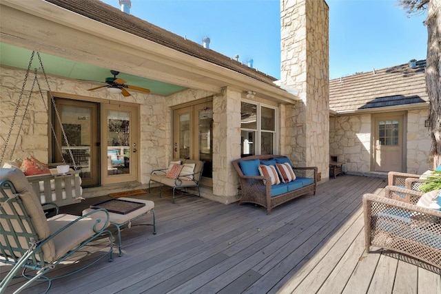 deck with ceiling fan and outdoor lounge area