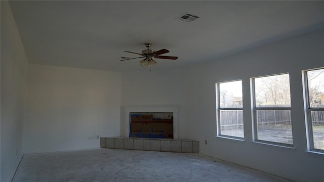 unfurnished living room featuring visible vents and ceiling fan