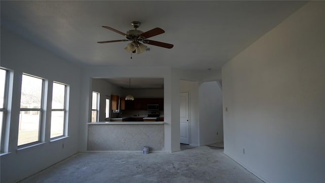 interior space featuring a ceiling fan