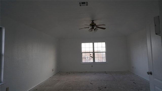 spare room featuring visible vents and a ceiling fan