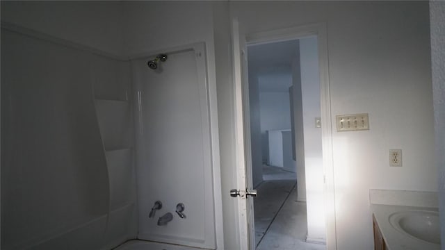 bathroom with vanity and bathing tub / shower combination