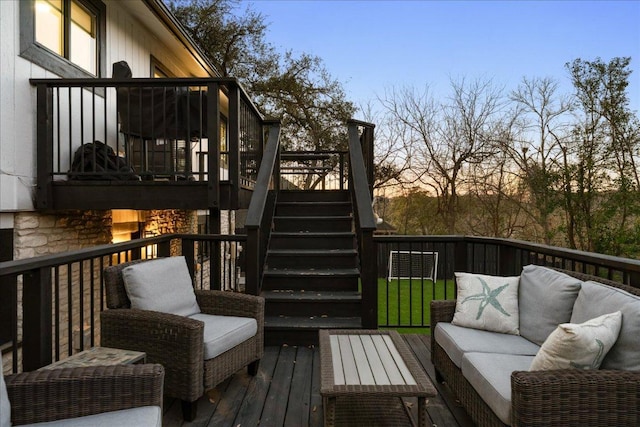 deck with an outdoor living space and stairs