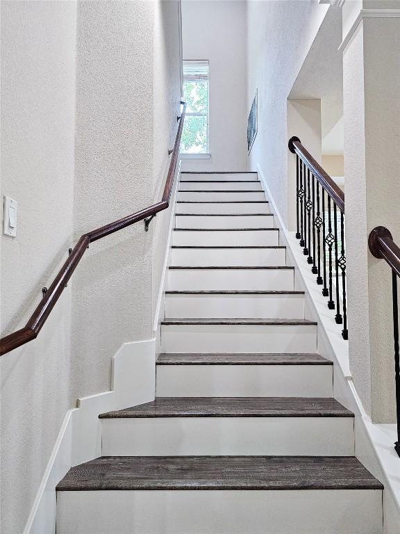 stairs with a textured wall