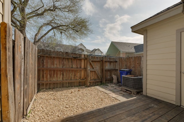 12249 Abbey Glen Ln Unit B, Austin, TX 78753 - deck with central AC unit, a fenced backyard, and a gate