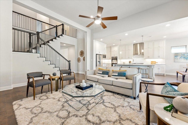 living room featuring dark wood finished floors and baseboards