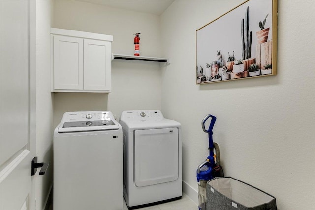 laundry area with washing machine and dryer and cabinet space