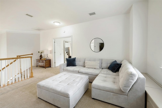 carpeted living room featuring visible vents