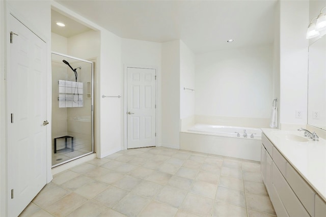 bathroom featuring a stall shower, recessed lighting, a bath, and vanity