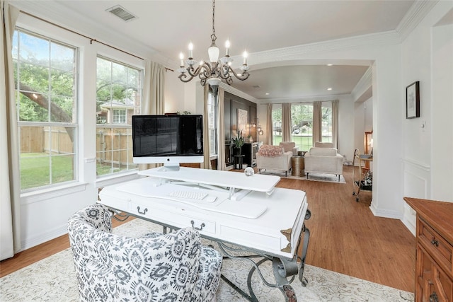 game room featuring an inviting chandelier, crown molding, visible vents, and wood finished floors