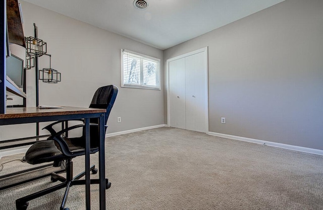 home office featuring carpet, visible vents, and baseboards