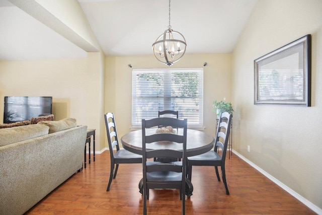 16710 Sabertooth Dr, Round Rock, TX 78681 - dining space featuring vaulted ceiling, a chandelier, wood finished floors, and baseboards
