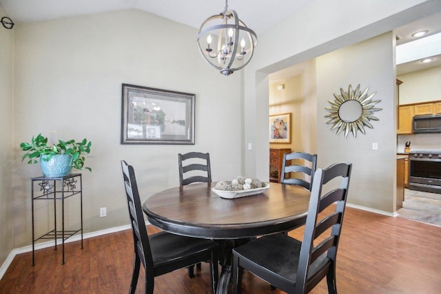 16710 Sabertooth Dr, Round Rock, TX 78681 - dining space featuring a chandelier, baseboards, light wood-style floors, and vaulted ceiling