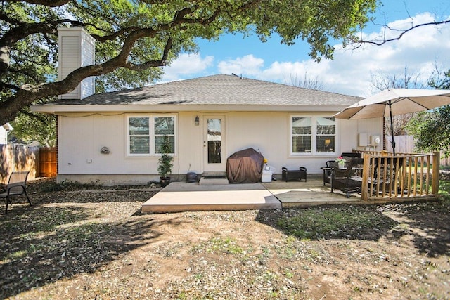 16710 Sabertooth Dr, Round Rock, TX 78681 - rear view of property with a patio area, a chimney, and roof with shingles