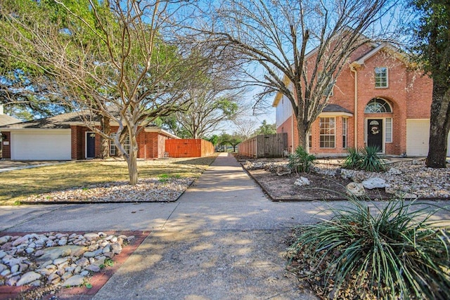 16710 Sabertooth Dr, Round Rock, TX 78681 - view of front facade featuring brick siding, an attached garage, and a gate