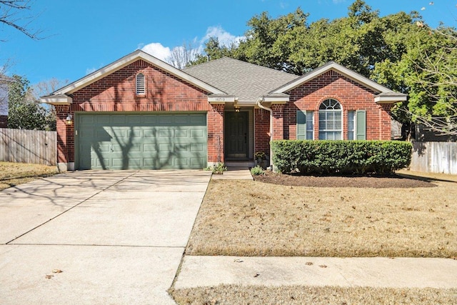 single story home featuring brick siding, a shingled roof, an attached garage, fence, and driveway