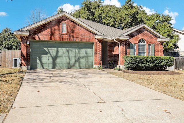 16710 Sabertooth Dr, Round Rock, TX 78681 - single story home with brick siding, a garage, and driveway