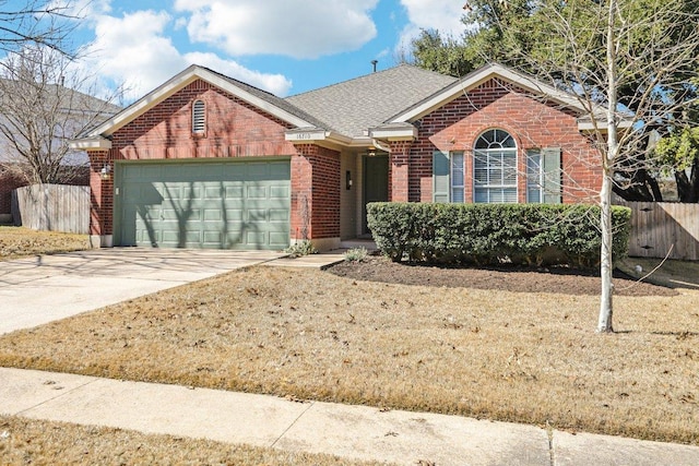 16710 Sabertooth Dr, Round Rock, TX 78681 - ranch-style house with brick siding, an attached garage, concrete driveway, and roof with shingles