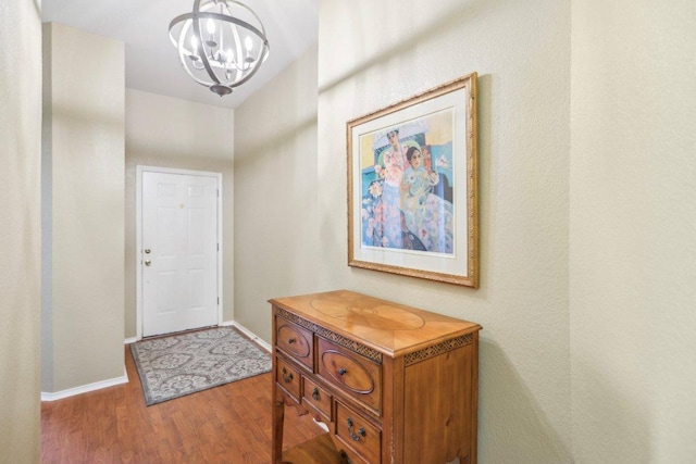 16710 Sabertooth Dr, Round Rock, TX 78681 - foyer with a chandelier, wood finished floors, and baseboards