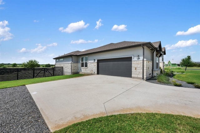 view of home's exterior featuring a garage, concrete driveway, fence, and stucco siding